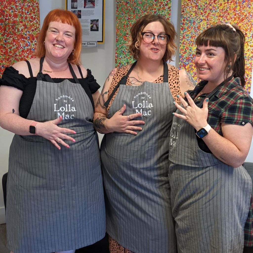 Friends having fun at a LollaMac jewellery making workshop